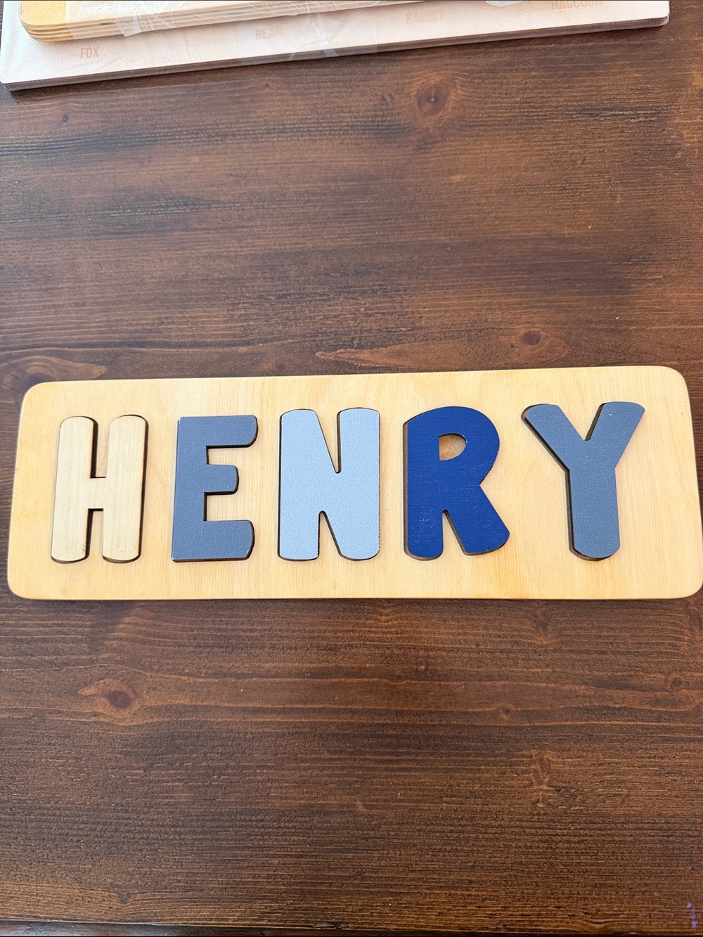 Wooden Name Puzzle "HENRY" in Blue and Natural